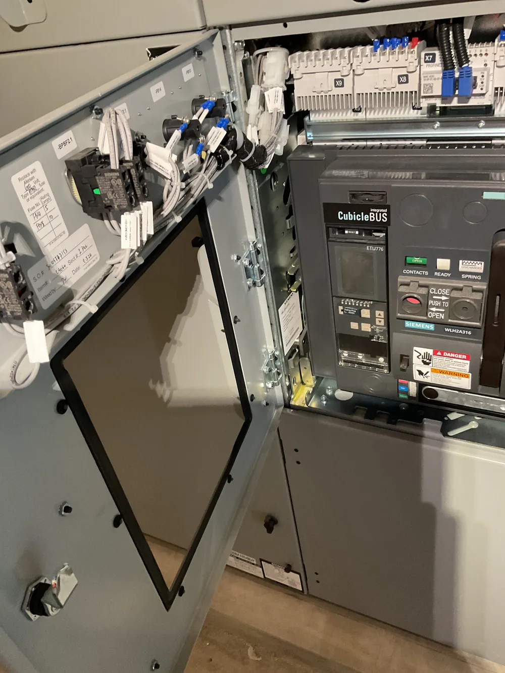 Electrical control cabinet with an industrial variable-frequency drive.