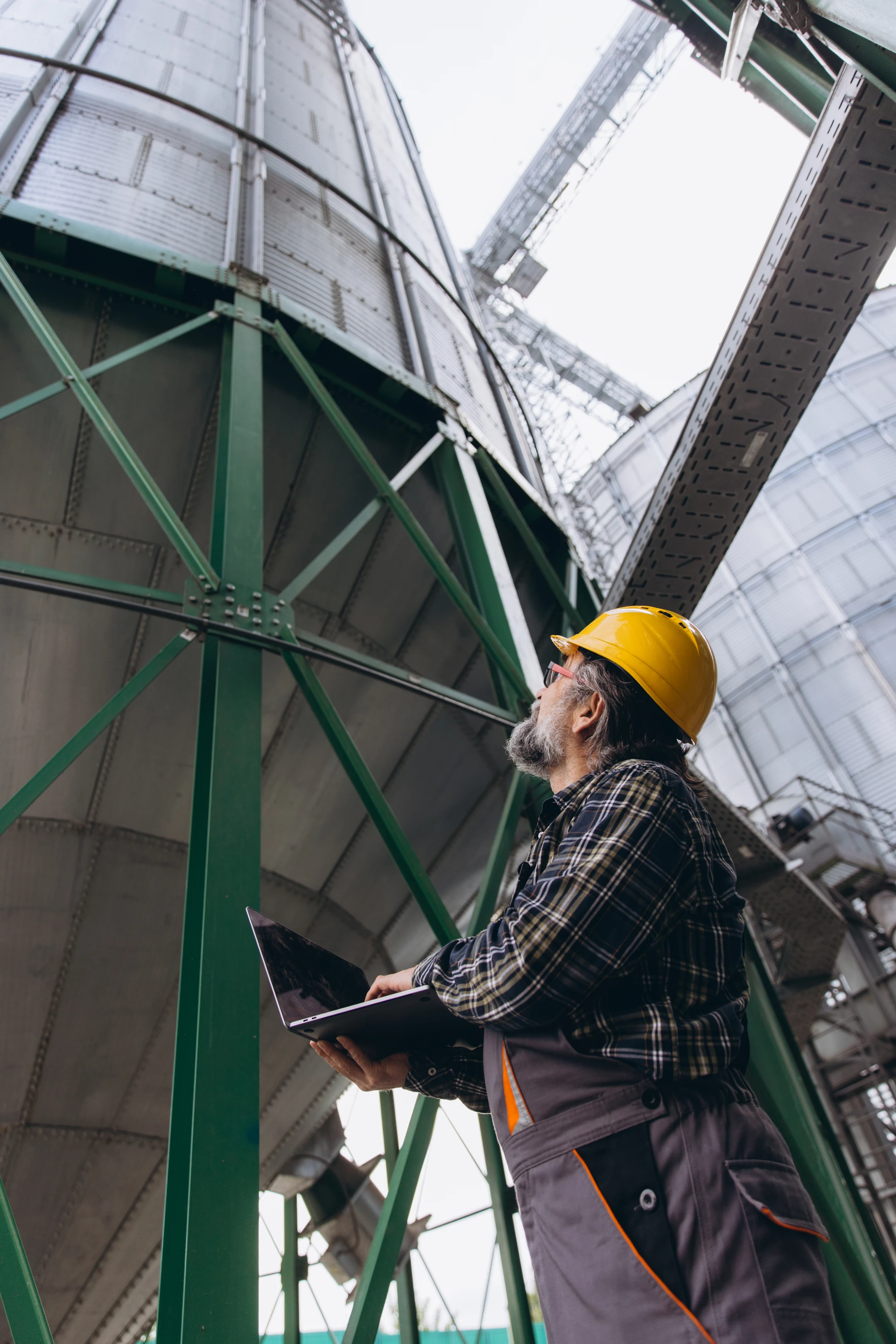 Technician assessing equipment at a grain facility